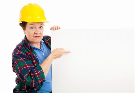 plumber (female) - Female construction worker points at blank white space, ready for text.  Isolated on white. Stock Photo - Budget Royalty-Free & Subscription, Code: 400-04200035