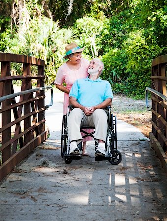simsearch:400-04208630,k - Devoted senior wife cares for her disabled husband. Stock Photo - Budget Royalty-Free & Subscription, Code: 400-04200040