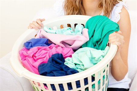 simsearch:400-08693600,k - Close-up of a caucasian woman doing laundry against a white background Stock Photo - Budget Royalty-Free & Subscription, Code: 400-04202392