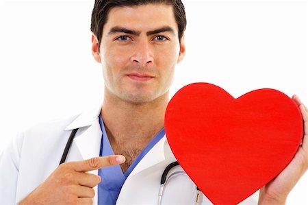 Stock image of Doctor pointing at red heart shape Foto de stock - Super Valor sin royalties y Suscripción, Código: 400-04202485