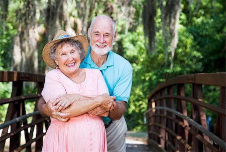 simsearch:400-04208630,k - Portrait of a romantic senior couple on a bridge with Spanish Moss hanging overhead. Stock Photo - Budget Royalty-Free & Subscription, Code: 400-04203917