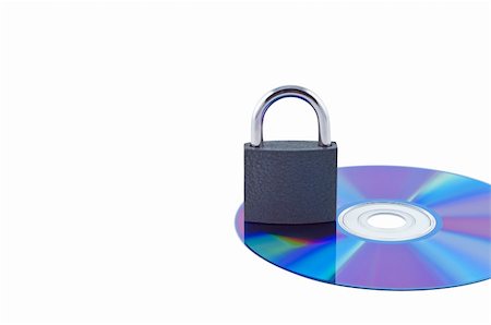dvd silhouette - Lock on a cd isolated on white. Foto de stock - Super Valor sin royalties y Suscripción, Código: 400-04215210
