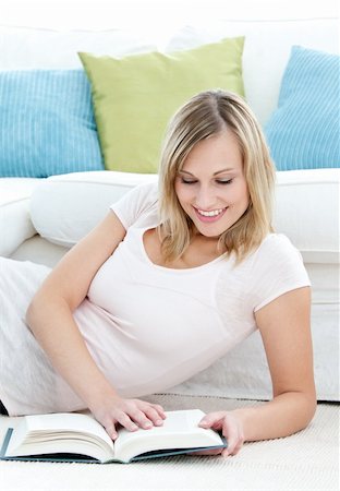simsearch:400-04418460,k - Bright blond,woman reading a book on the floor in the living room Stock Photo - Budget Royalty-Free & Subscription, Code: 400-04210037