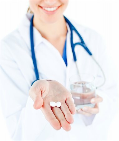 simsearch:400-05748252,k - Close-up of caucasian doctor holding pills and water against white background Stock Photo - Budget Royalty-Free & Subscription, Code: 400-04210574