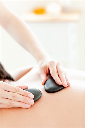 simsearch:400-04192063,k - Close-up of a young man receiving a massage with hot stone in a health spa Stock Photo - Budget Royalty-Free & Subscription, Code: 400-04210867
