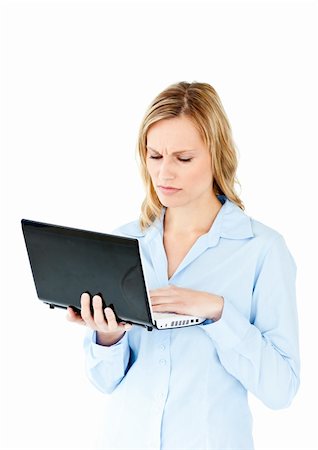 simsearch:400-05729275,k - Young businesswoman getting frustrated with a laptop against a white background Stock Photo - Budget Royalty-Free & Subscription, Code: 400-04212354