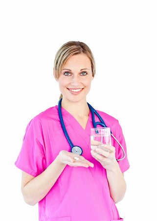 simsearch:400-05748252,k - Pretty female doctor holding pills and water against a white background Stock Photo - Budget Royalty-Free & Subscription, Code: 400-04212857