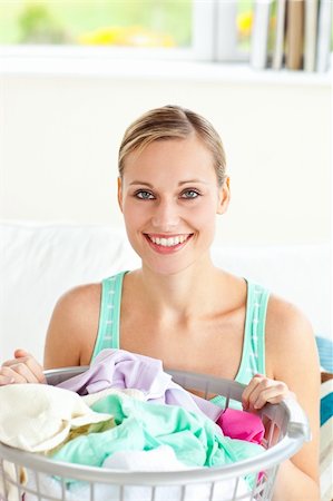 simsearch:400-08693600,k - Cheerful young woman doing the laundry at home Stock Photo - Budget Royalty-Free & Subscription, Code: 400-04213175
