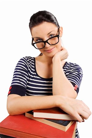 simsearch:400-04860880,k - nice girl on some books looking over her big glasses and smiling Stock Photo - Budget Royalty-Free & Subscription, Code: 400-04213420