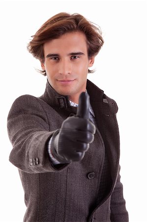 simsearch:400-04875087,k - Portrait of a young businessman with thumb up, in autumn/winter clothes, isolated on white. Studio shot Photographie de stock - Aubaine LD & Abonnement, Code: 400-04213592