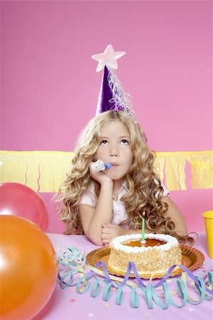 simsearch:859-03983201,k - bored little blond girl in a birthday party with cake and candle on pink background Stock Photo - Budget Royalty-Free & Subscription, Code: 400-04224986