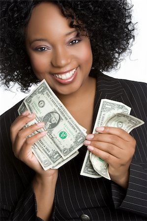 simsearch:400-05718324,k - Smiling black woman holding money Stock Photo - Budget Royalty-Free & Subscription, Code: 400-04226221