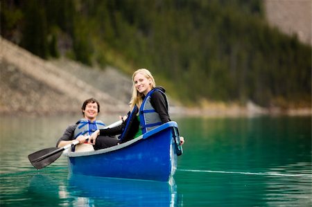 A portrait of a happy woman on a canoeing trip with a man Stock Photo - Budget Royalty-Free & Subscription, Code: 400-04227084
