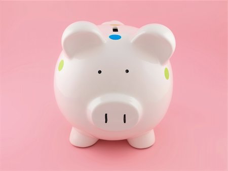 simsearch:400-06077471,k - A piggy bank isolated against a pink background Stock Photo - Budget Royalty-Free & Subscription, Code: 400-04227874