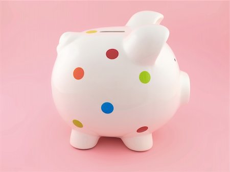 simsearch:400-06077471,k - A piggy bank isolated against a pink background Stock Photo - Budget Royalty-Free & Subscription, Code: 400-04227875
