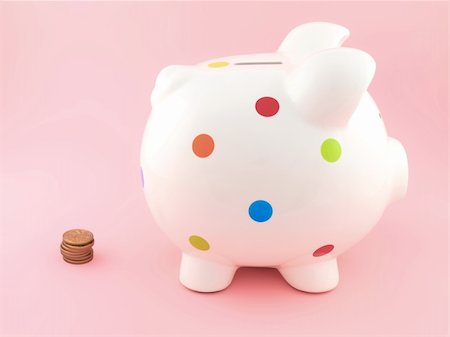 simsearch:400-06077471,k - A piggy bank isolated against a pink background Stock Photo - Budget Royalty-Free & Subscription, Code: 400-04227876