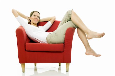 simsearch:400-04398921,k - Young woman sitting on a chair on white background studio Stock Photo - Budget Royalty-Free & Subscription, Code: 400-04220452