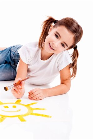 simsearch:644-01630853,k - Girl lying on floor and painting a happy sun Stock Photo - Budget Royalty-Free & Subscription, Code: 400-04234034