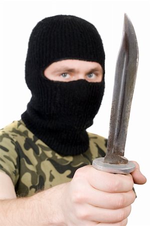 Portrait of the killer with a knife. Focus on the knife Stock Photo - Budget Royalty-Free & Subscription, Code: 400-04234205