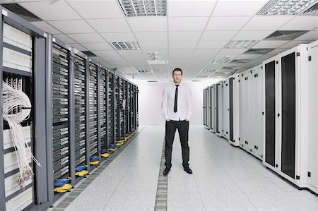 simsearch:400-05291415,k - young handsome business man  engeneer in datacenter server room Stock Photo - Budget Royalty-Free & Subscription, Code: 400-04239407