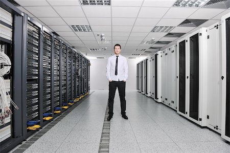 simsearch:400-04239432,k - young handsome business man  engeneer in datacenter server room Stock Photo - Budget Royalty-Free & Subscription, Code: 400-04239409