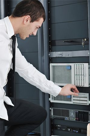 simsearch:400-05291415,k - young handsome business man  engeneer in datacenter server room Stock Photo - Budget Royalty-Free & Subscription, Code: 400-04239424