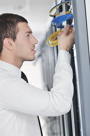 simsearch:400-04239432,k - young handsome business man  engeneer in datacenter server room Stock Photo - Budget Royalty-Free & Subscription, Code: 400-04239426