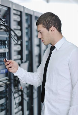 simsearch:400-05881495,k - young handsome business man  engeneer in datacenter server room Stock Photo - Budget Royalty-Free & Subscription, Code: 400-04239420