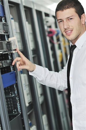simsearch:400-05291415,k - young handsome business man  engeneer in datacenter server room Stock Photo - Budget Royalty-Free & Subscription, Code: 400-04239435