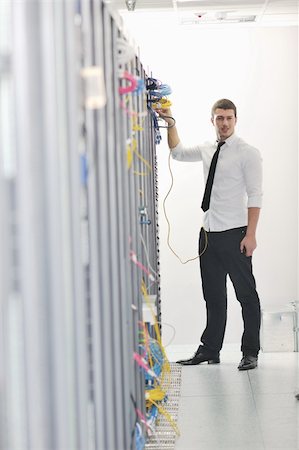 simsearch:400-05291415,k - young handsome business man  engeneer in datacenter server room Stock Photo - Budget Royalty-Free & Subscription, Code: 400-04239436