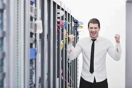 simsearch:400-04239432,k - young handsome business man  engeneer in datacenter server room Stock Photo - Budget Royalty-Free & Subscription, Code: 400-04239432