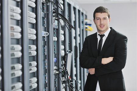 simsearch:400-04239432,k - young handsome business man  engeneer in datacenter server room Stock Photo - Budget Royalty-Free & Subscription, Code: 400-04239457