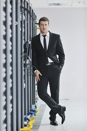 simsearch:400-05881495,k - young handsome business man  engeneer in datacenter server room Stock Photo - Budget Royalty-Free & Subscription, Code: 400-04239458