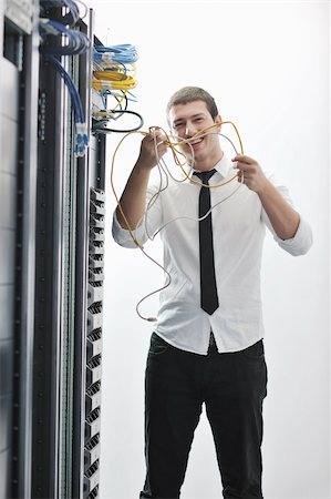 simsearch:400-05291415,k - young handsome business man  engeneer in datacenter server room Stock Photo - Budget Royalty-Free & Subscription, Code: 400-04239452