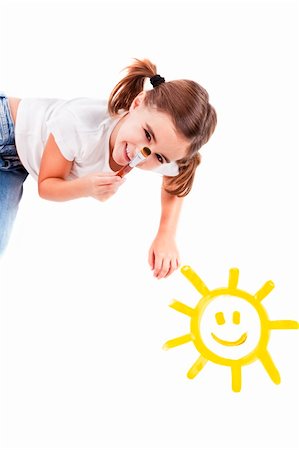 Top view of a happy girl lying on floor and painting a happy sun Stock Photo - Budget Royalty-Free & Subscription, Code: 400-04230863