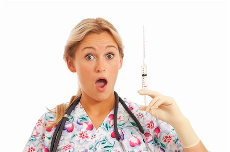 stethoscope funny - Humorous Portrait of young nurse with stethoscope and syringe Stock Photo - Budget Royalty-Free & Subscription, Code: 400-04232429