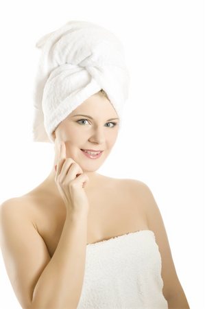 simsearch:400-05322963,k - beautiful young woman in bath towel touching her skin and smiling Stock Photo - Budget Royalty-Free & Subscription, Code: 400-04232536