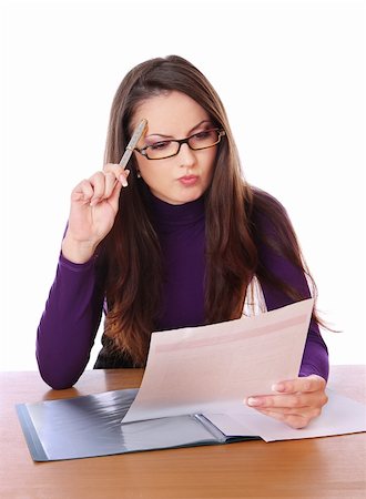 pretty woman is reading document and thinking. Isolated at white background Stock Photo - Budget Royalty-Free & Subscription, Code: 400-04233334