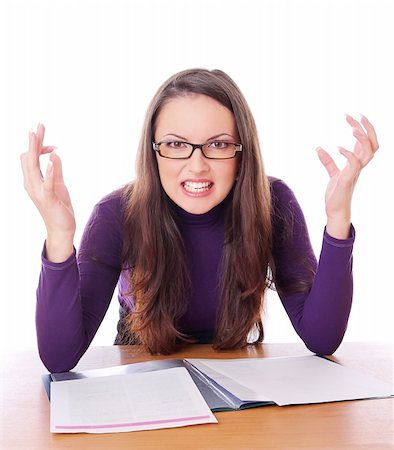 pretty woman with glasses is angry. Isolated at white background Stock Photo - Budget Royalty-Free & Subscription, Code: 400-04233337