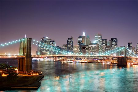 simsearch:400-07424733,k - New York City Brooklyn Bridge and Manhattan skyline with skyscrapers over Hudson River illuminated with lights at dusk after sunset. Stock Photo - Budget Royalty-Free & Subscription, Code: 400-04240625
