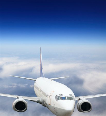 the airplane on  the blue sky background. Stock Photo - Budget Royalty-Free & Subscription, Code: 400-04241095