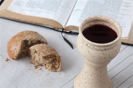 Chalice with red wine, bread and Holy Bible on a tablecloth. Shallow dof Stock Photo - Budget Royalty-Free & Subscription, Code: 400-04242519