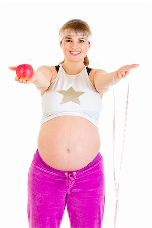 simsearch:400-04798379,k - Smiling beautiful pregnant woman holding measure tape and  apple isolated on white Stock Photo - Budget Royalty-Free & Subscription, Code: 400-04243267