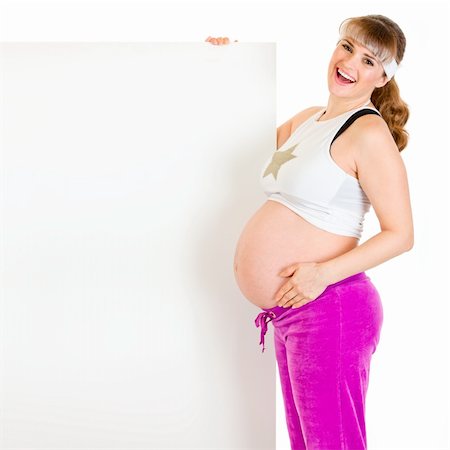 simsearch:400-04798379,k - Smiling beautiful pregnant woman holding blank billboard  isolated on white Stock Photo - Budget Royalty-Free & Subscription, Code: 400-04243269