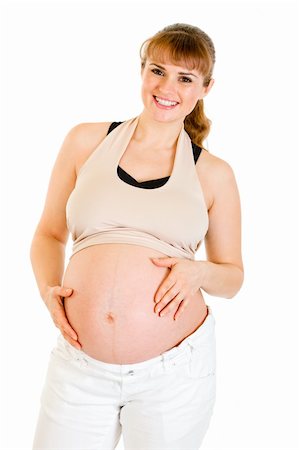 simsearch:400-04817039,k - Smiling beautiful pregnant woman holding her belly isolated on white background Stock Photo - Budget Royalty-Free & Subscription, Code: 400-04243274