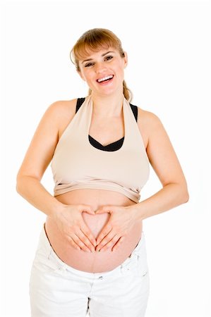 Smiling pregnant woman making heart with her hands on belly isolated on white Stock Photo - Budget Royalty-Free & Subscription, Code: 400-04243279