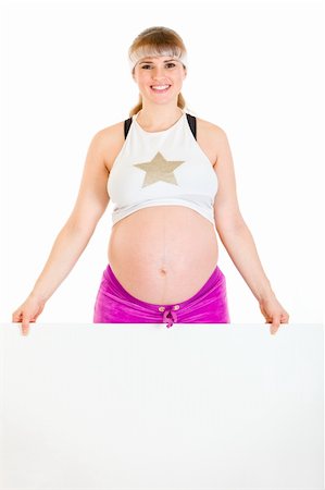 simsearch:400-04798379,k - Smiling beautiful pregnant woman holding blank billboard  isolated on white Stock Photo - Budget Royalty-Free & Subscription, Code: 400-04243271