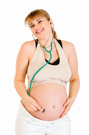 simsearch:400-04798379,k - Happy pregnant woman holding stethascope on her belly isolated on white Stock Photo - Budget Royalty-Free & Subscription, Code: 400-04243282