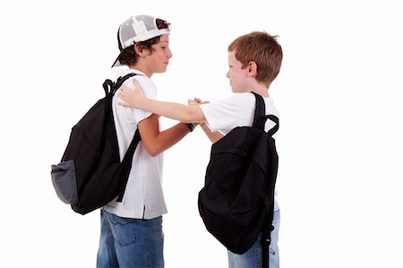 boys going to school, greeting one another, seen from the back, on white, studio shot Stock Photo - Budget Royalty-Free & Subscription, Code: 400-04243390