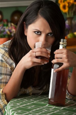 Alcoholic Latina Woman at Home with Liquor Bottle Stock Photo - Budget Royalty-Free & Subscription, Code: 400-04256634